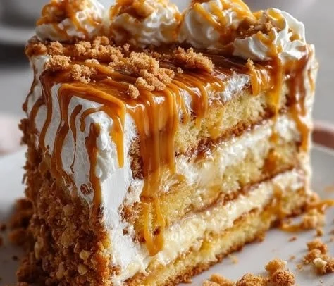 1735855500050-b33rq64b Delicious Butterscotch Crunch Cake topped with crunchy bits and drizzled with sauce