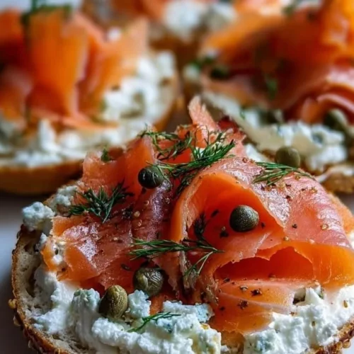 Cottage Cheese Bagels topped with smoked salmon and garnished with herbs