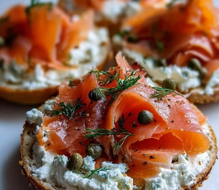 Cottage Cheese Bagels topped with smoked salmon and garnished with herbs