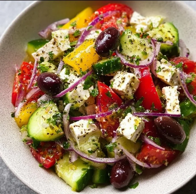 1735855500050-b33rq64b Fresh Greek salad with tomatoes, cucumbers, olives, and feta cheese