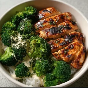 Grilled chicken and broccoli bowl with fresh vegetables and seasoning