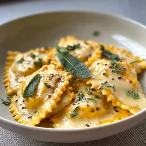 Easy butternut squash ravioli with maple cream sauce on a plate