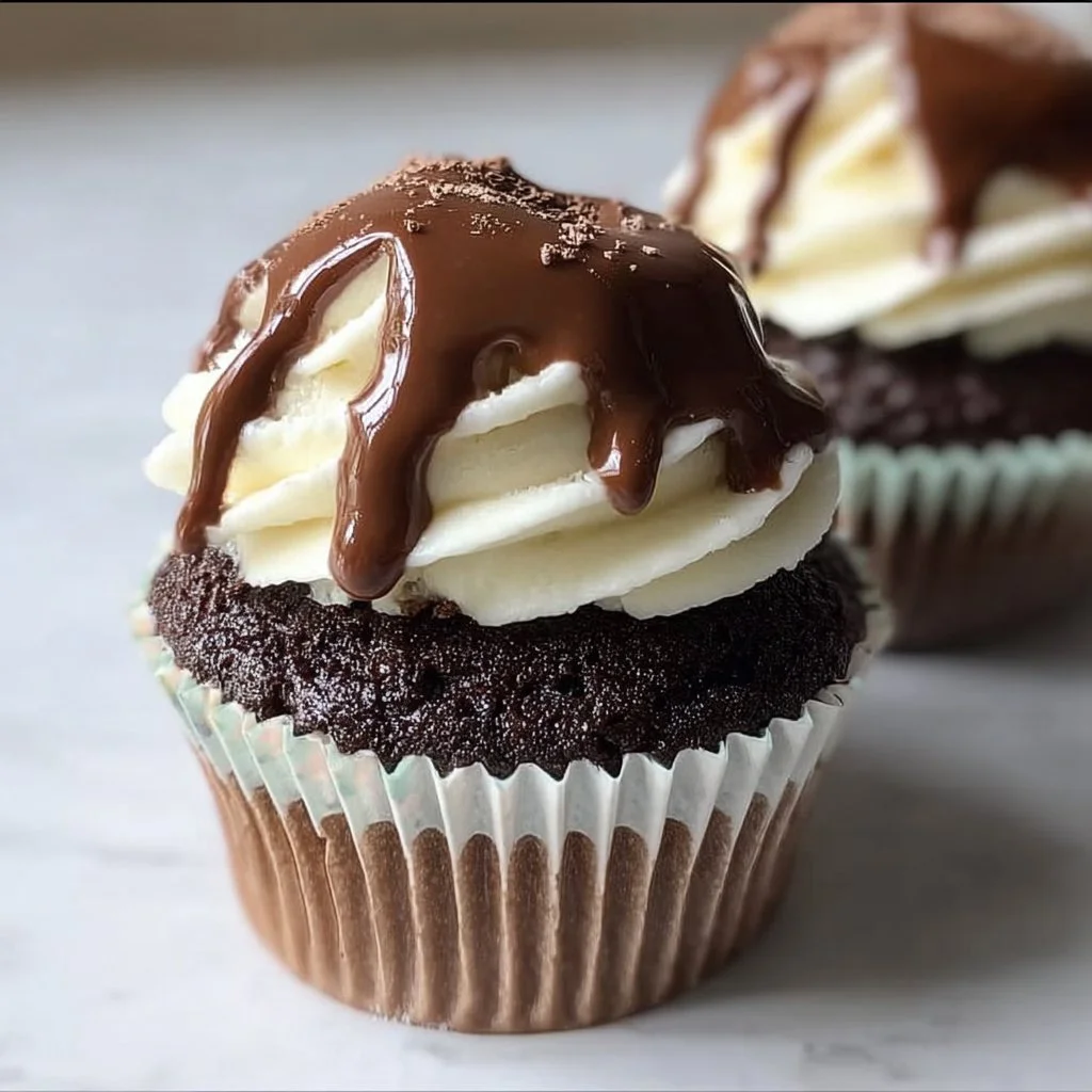 Dreamy Chocolate Cupcakes Filled with White Buttercream and Topped with Chocolate Ganache